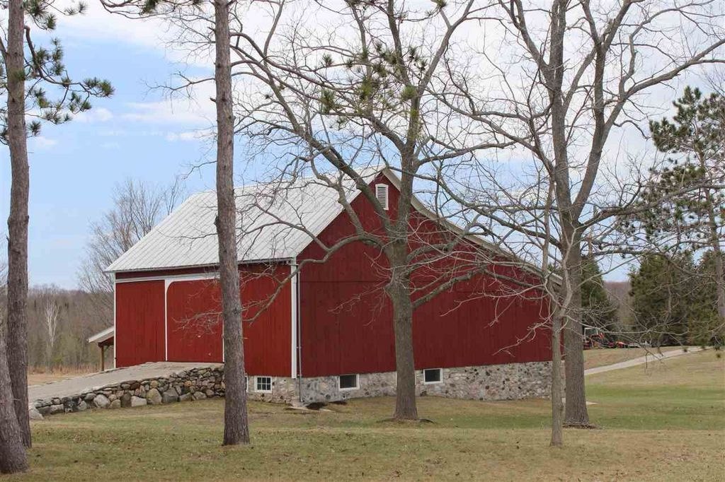 Red barn with stone foundation
